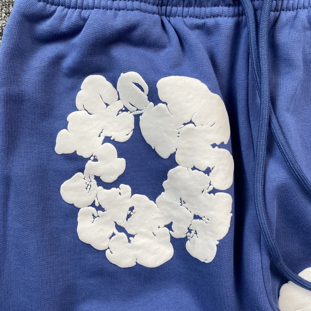 DENIM TEARS COTTON WREATH SWEATPANTS BLUE